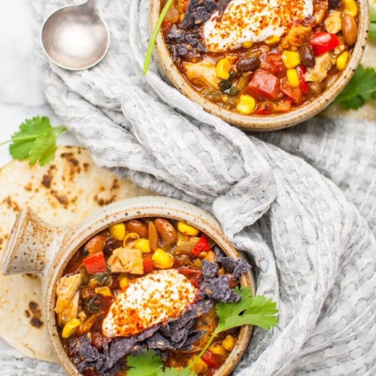 Two bowls of turkey enchilada soup.