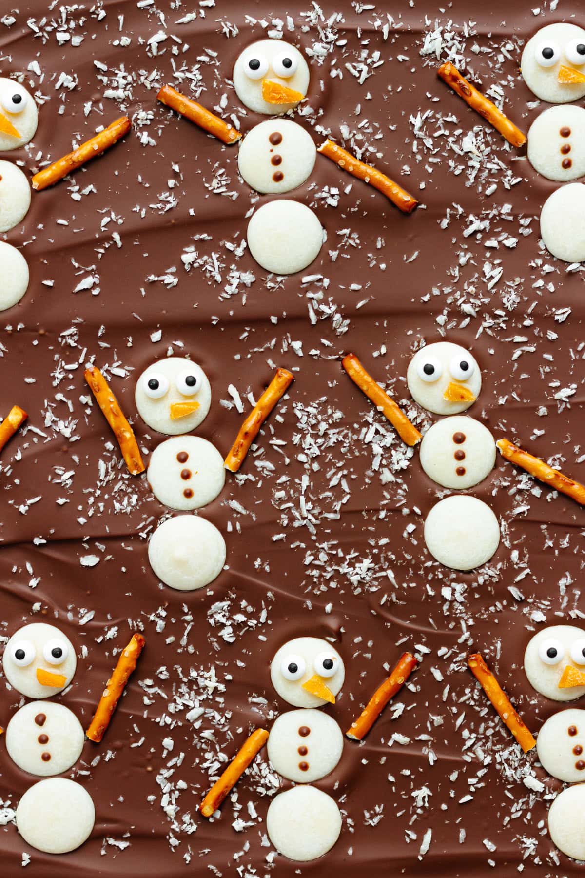 Christmas bark with white chocolate snowmen on top.