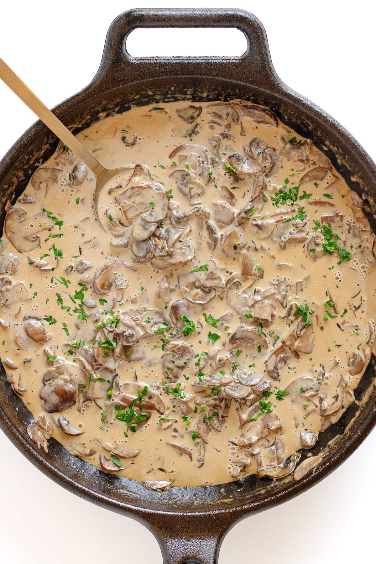 Creamy mushroom pan sauce in a cast iron skillet.