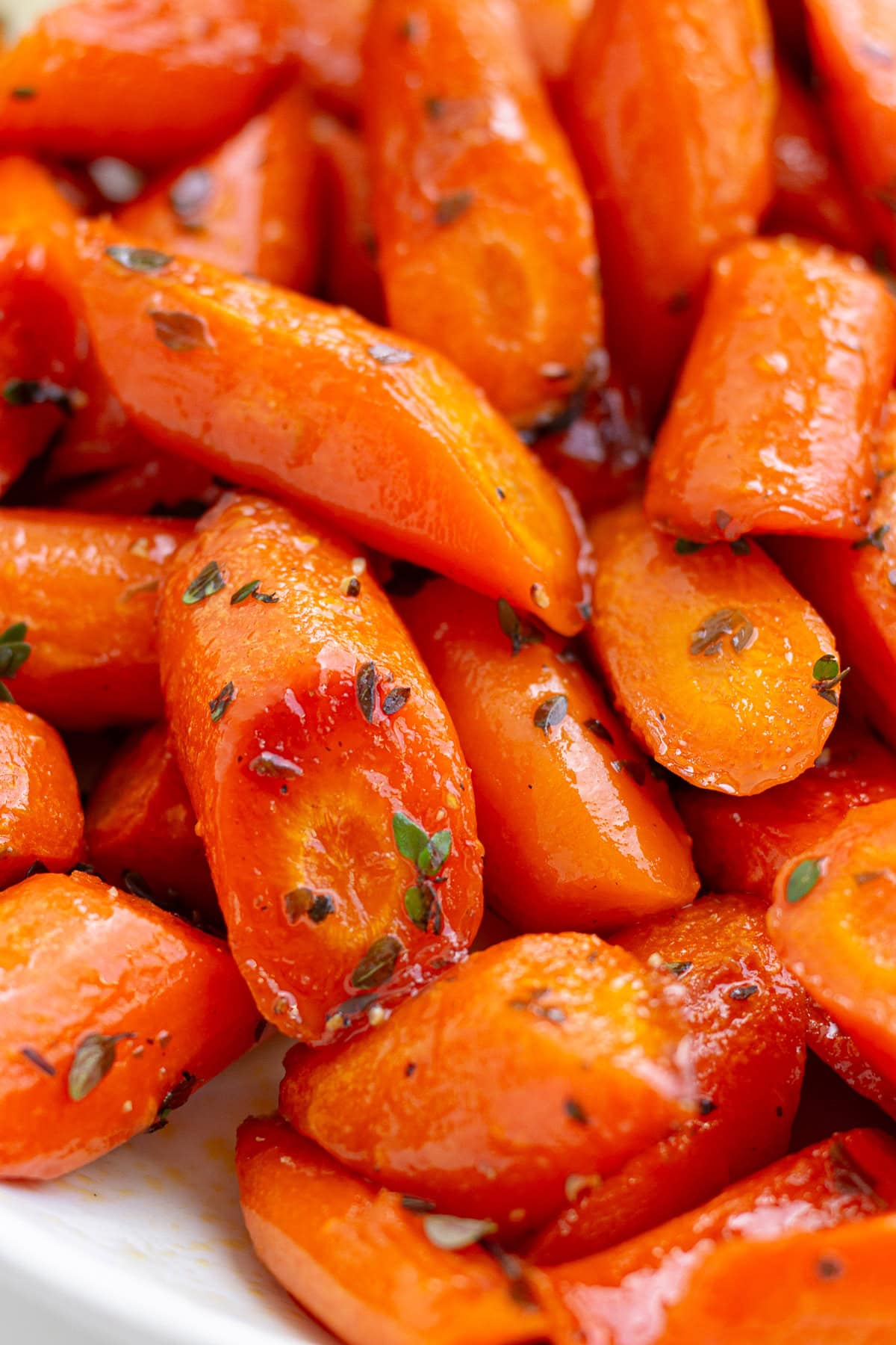 Closeup of roasted carrots with honey thyme glaze.