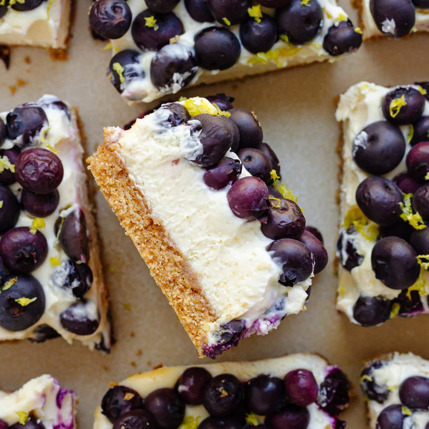 Closeup of the side of a blueberry cheesecake bar.