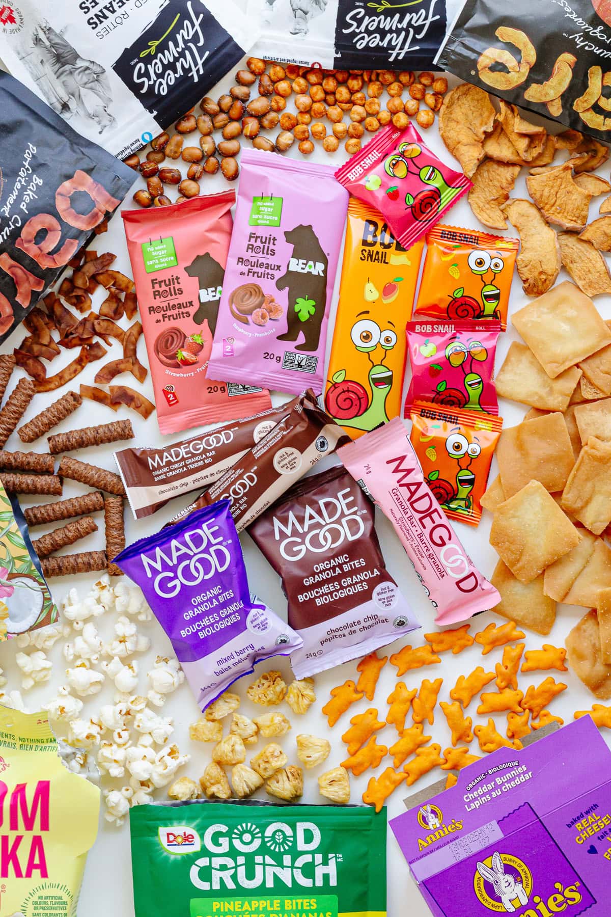 Overhead photo of a variety of packaged snacks for kids.