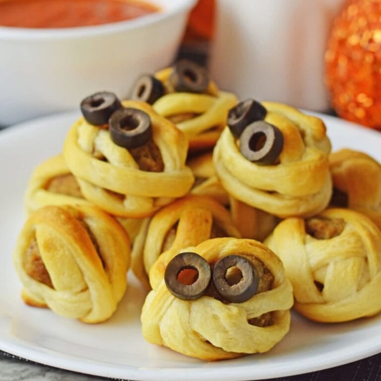 Plate of mummy themed Halloween meatballs.