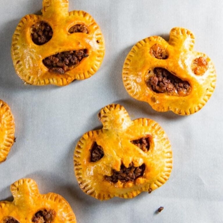 Chorizo hand pies shaped like jack-o-lanterns.