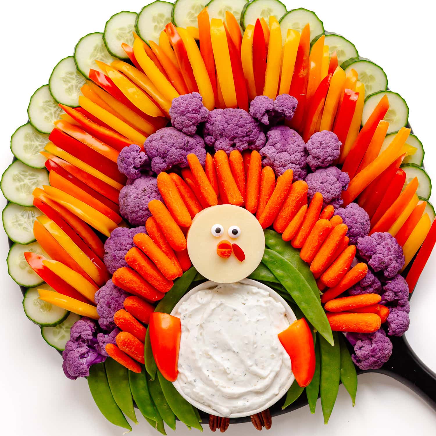 A Thanksgiving veggie tray arranged in the shape of a turkey.