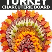 Pinterest graphic for a Thanksgiving charcuterie board shaped like a turkey.