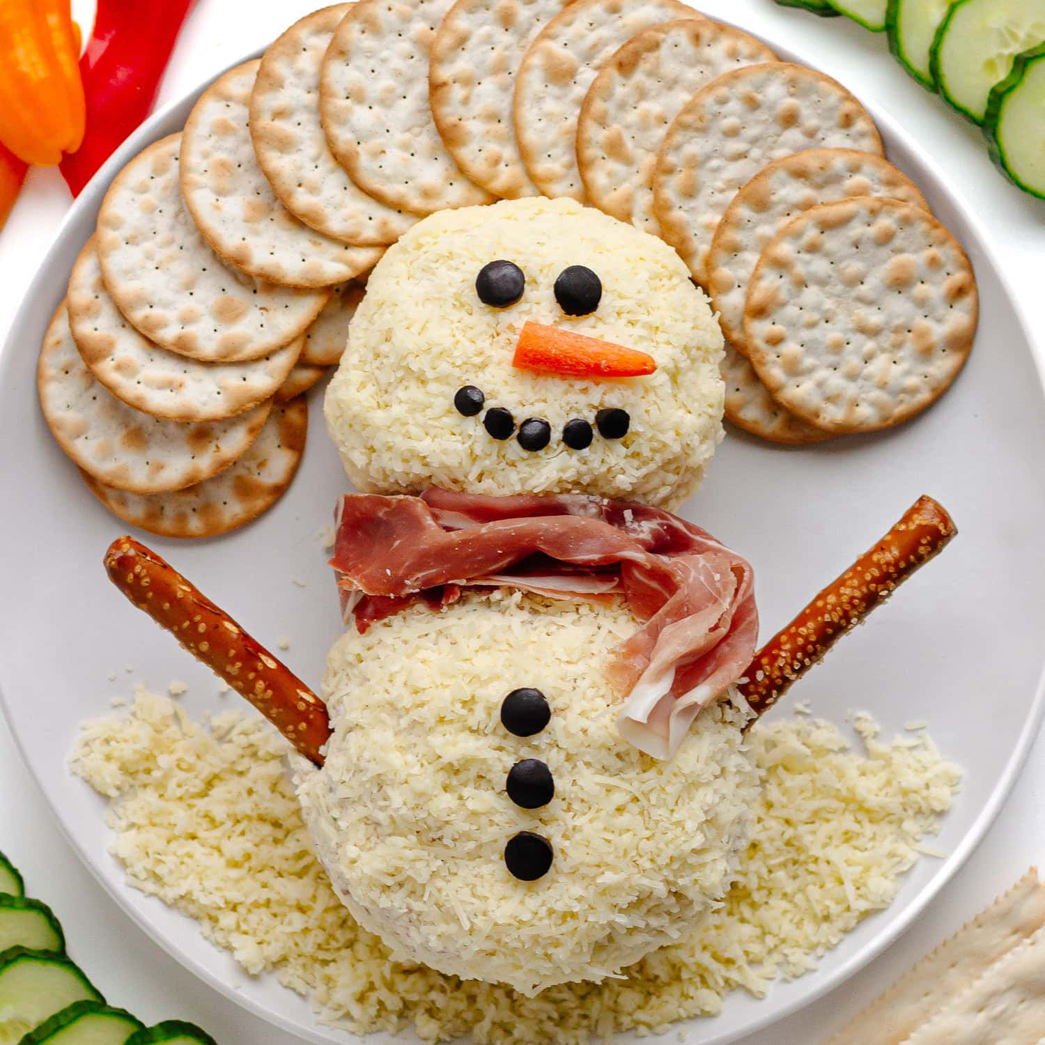 A Christmas snowman shaped cheese ball.