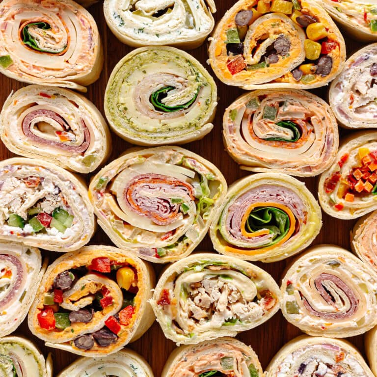 Closeup of a variety of different kinds of pinwheel sandwiches.