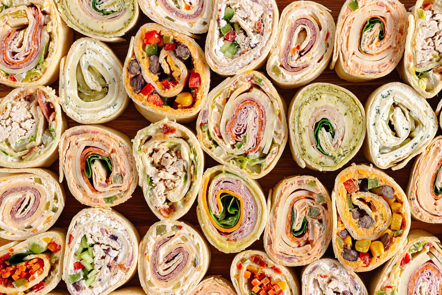 Variety of pinwheels on a serving board.