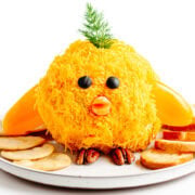 Easter baby chick cheese ball on a plate with crackers.