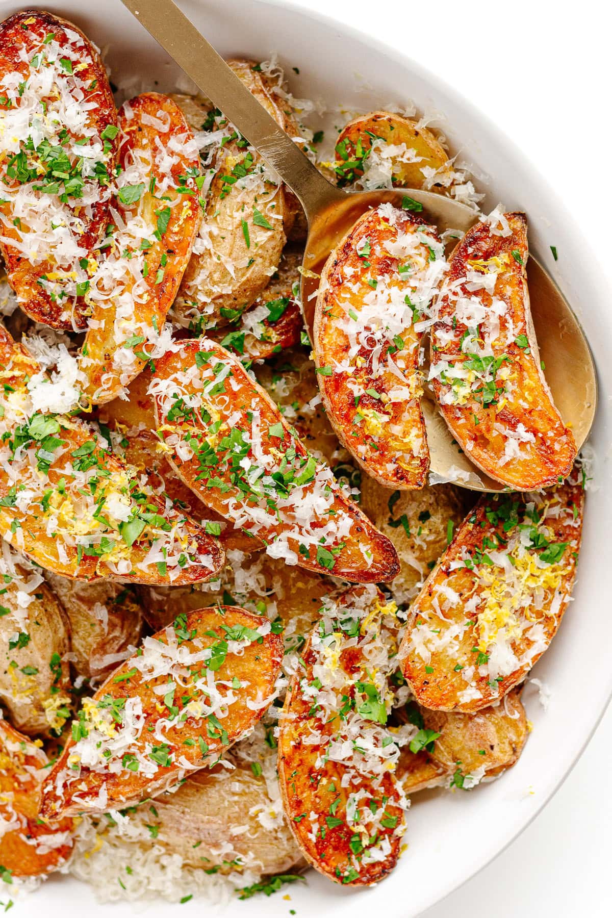 Parmesan truffle roasted fingerling potatoes in serving bowl.