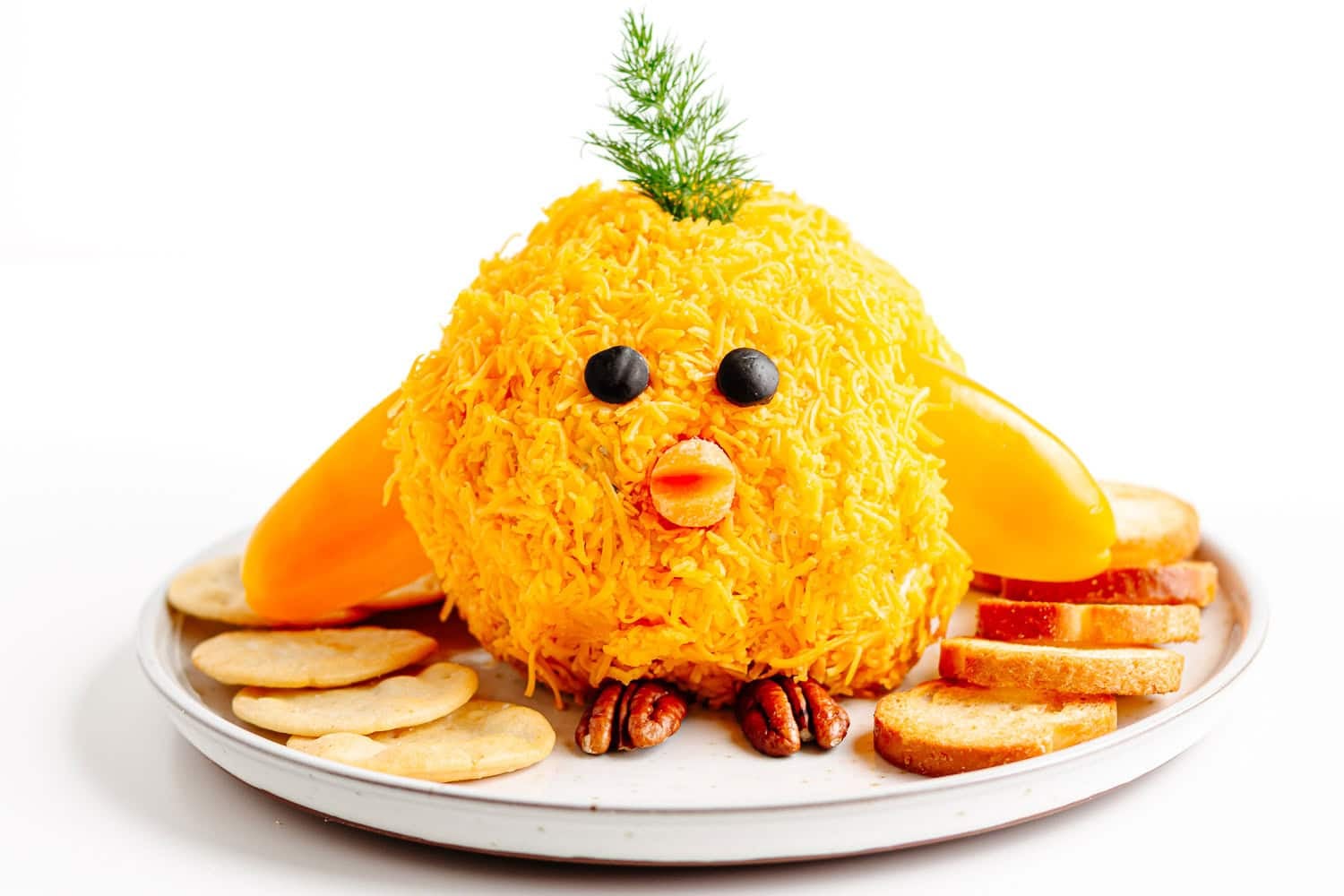 A spring inspired cheese ball shaped into a baby chick.