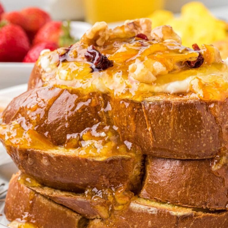 Pile of orange French toast.