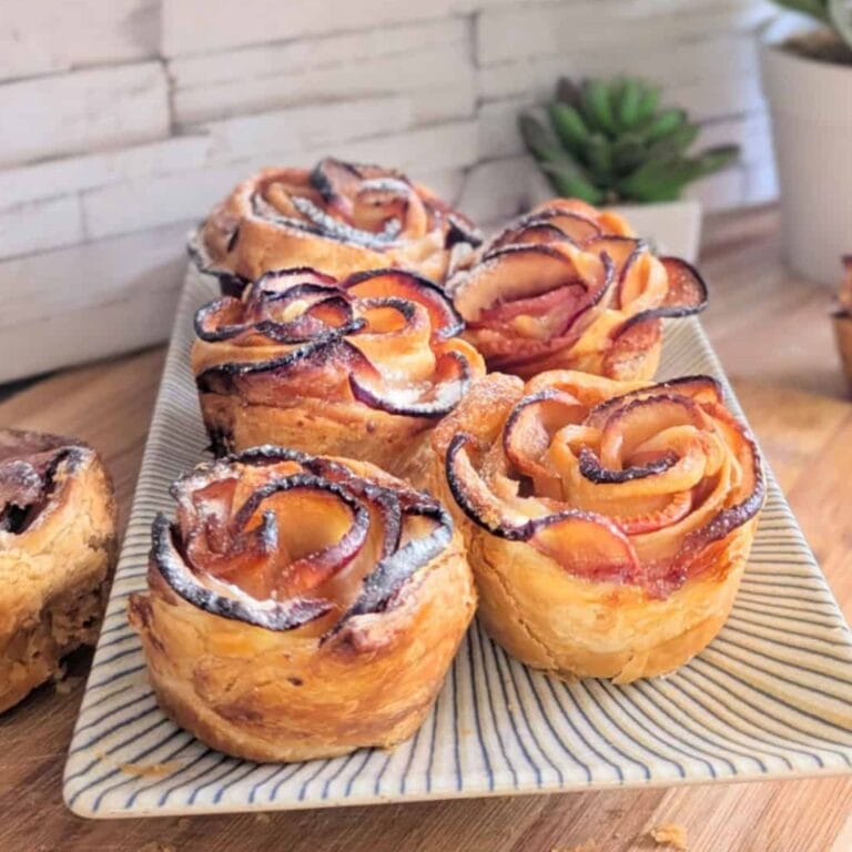 Puff pastry apple roses on a platter.