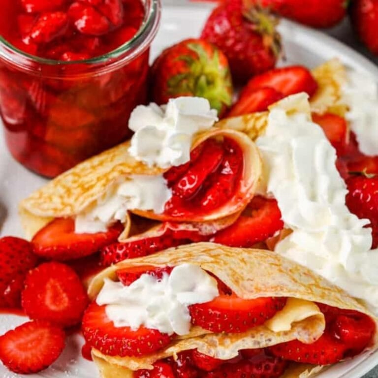 Strawberry crepes on a plate.