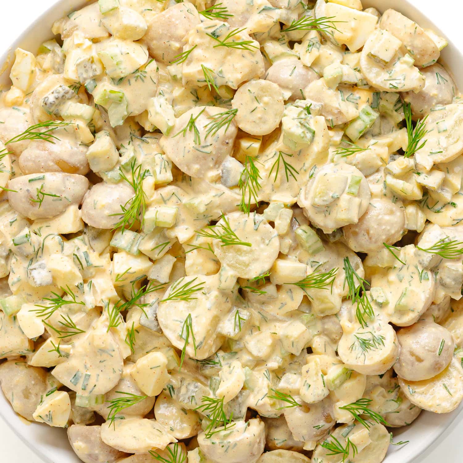 Bowl of creamy dill pickle potato salad.