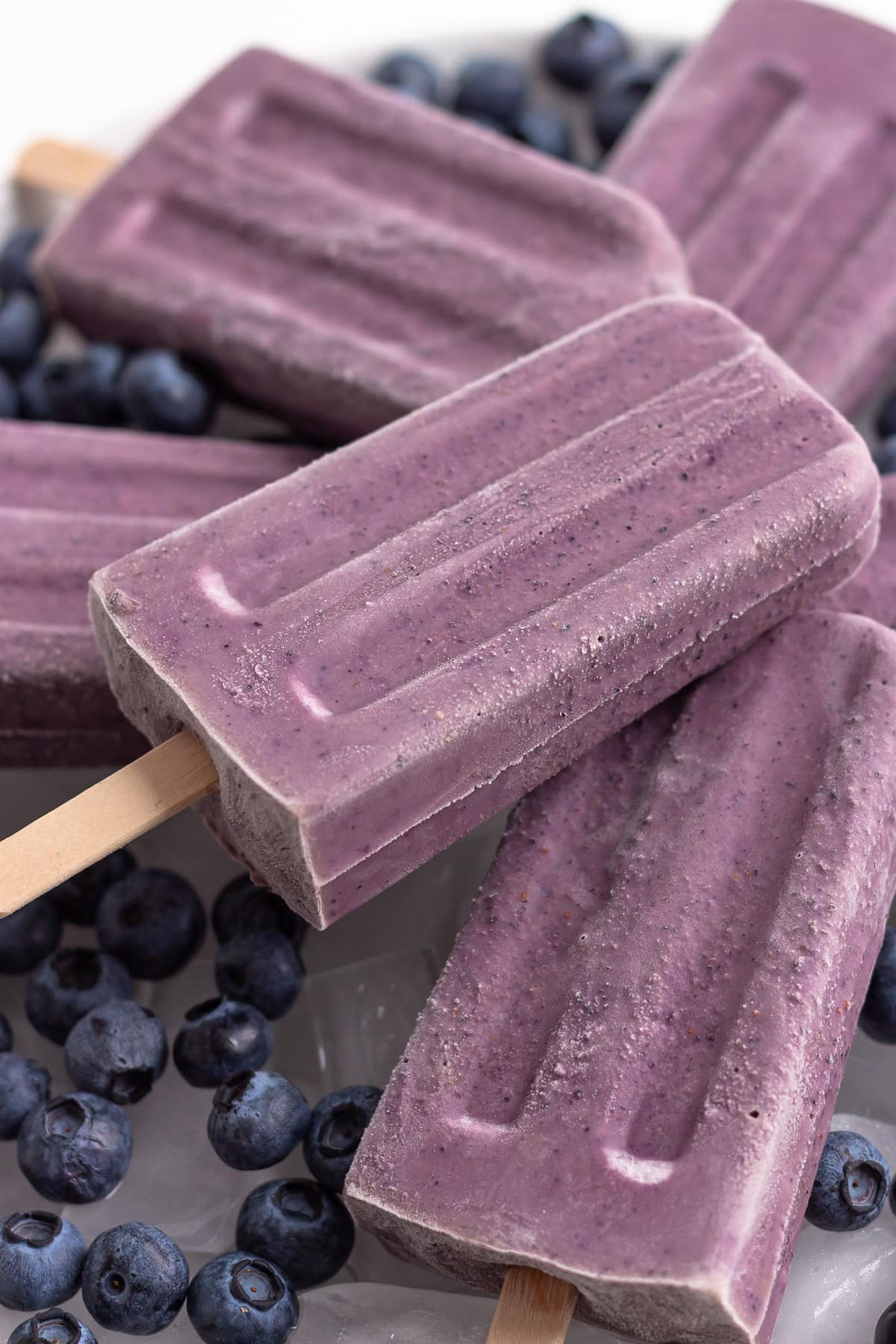 Pile of blueberry popsicles.