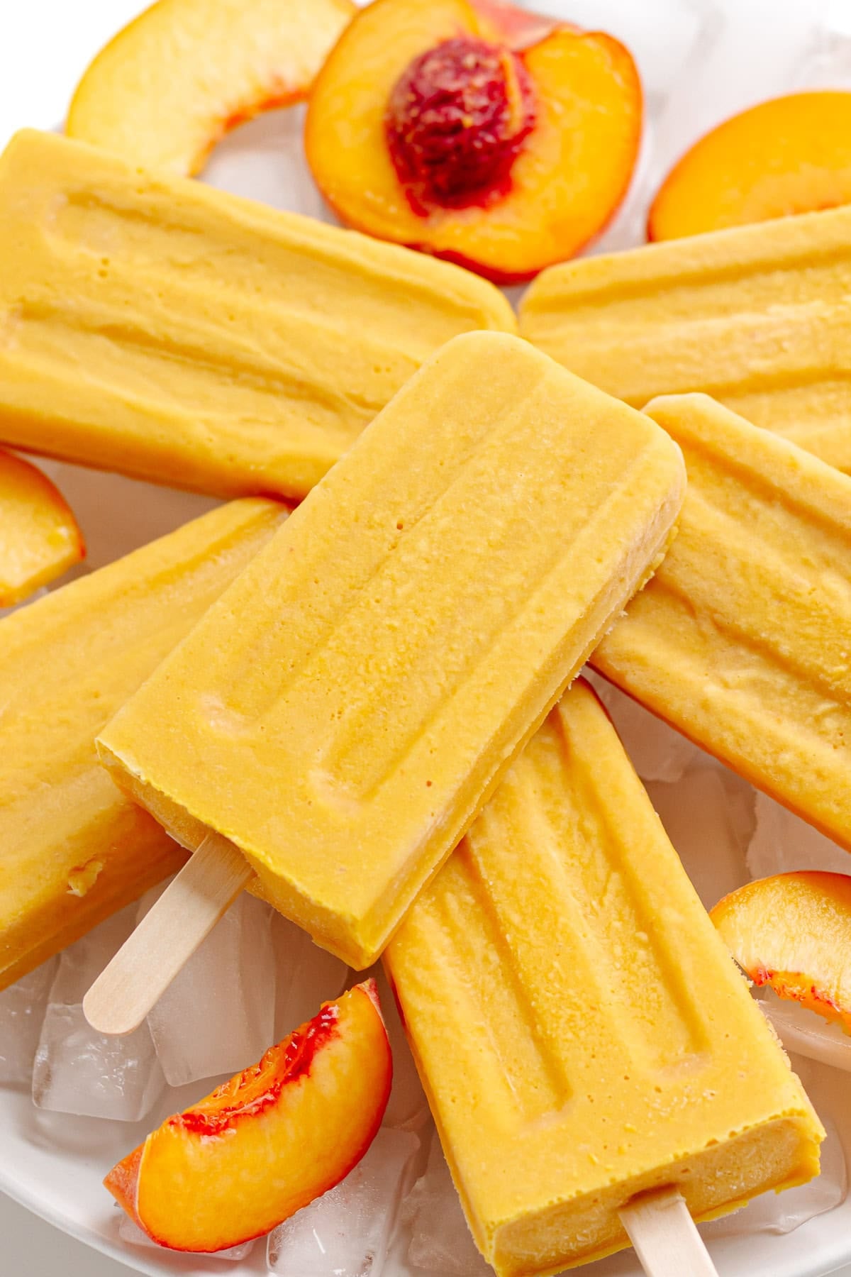 Pile of peaches and cream popsicles.