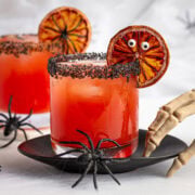 Blood orange Halloween margaritas with spooky garnishes.